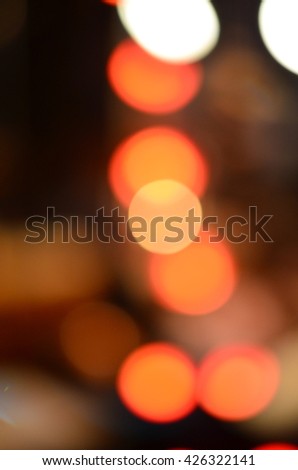image of blurred bokeh background with warm orange lights (blurred)