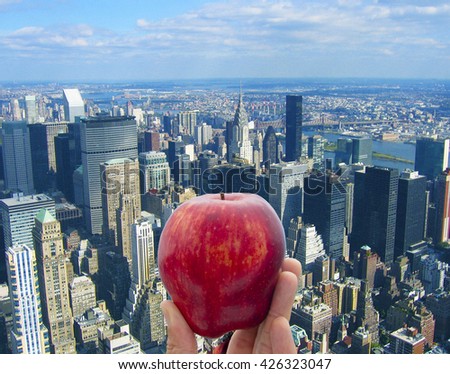 Holding an apple on rooftop of Empire State Tower, New York Royalty-Free Stock Photo #426323047