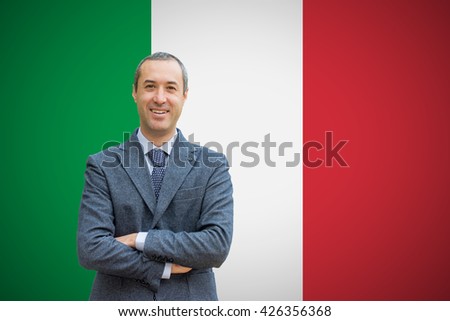 Teacher standing before of the italian and mexican flag