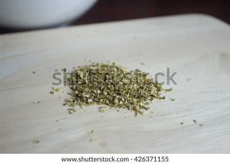 Dried Oregano on the block wooden prepared for cooking 