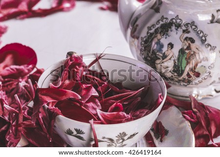 Porcelain Tea Set with Peony Petals Background