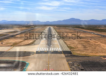 Pilot's view through the windshield at Runway 11L in Tucson, Arizona