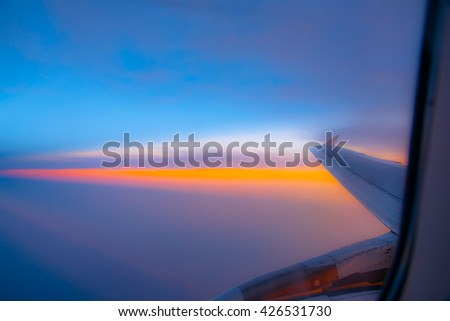 Abstract sunset skyline shading orange, yellow, golden, colorful sky, Beautiful light of hope from heaven concept. Orange yellow green blue colors patterns. Blur backgrounds concept.