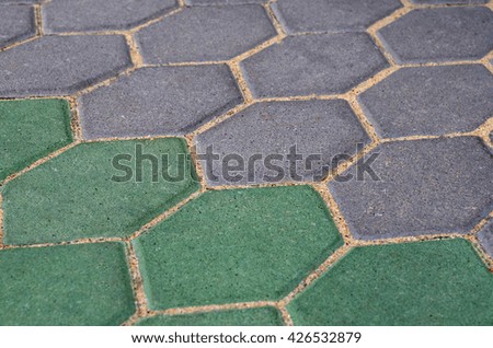 Gray and green hexagon cement block pavement