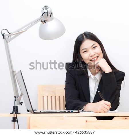 Woman with Laptop and coffee cup at office on white