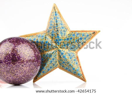 Single violet ball and blue star on white background