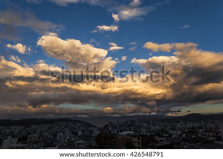 Dramatic gold and red skies over the city of Quito at sunset