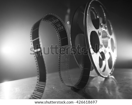 Reel of film on a black-white background 