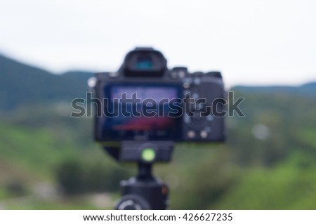 Blurred unfocused view of camera taking while taking pictures of tea plantation at Cameron Highland, Malaysia.