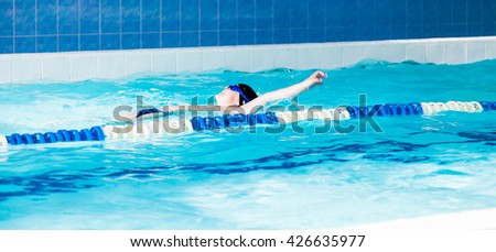 The boy involved in the sports of swimming 