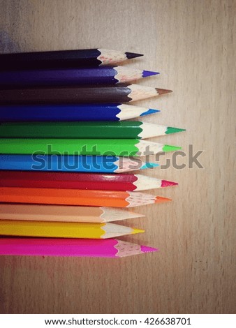 Color pencils on wood blackground