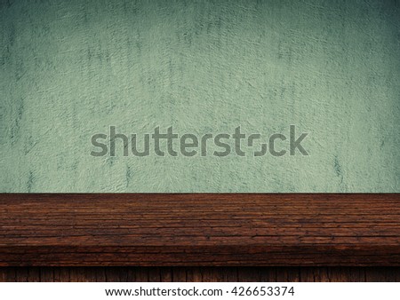 Empty wooden table top on grunge concrete wall, Use as montage for product display.