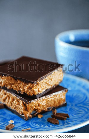 Tasty homemade cakes with chocolate on dark background, close up