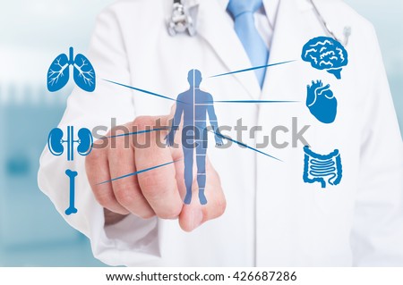 Young medic pointing on modern hologram with internal organs as good function and healthy organism concept Royalty-Free Stock Photo #426687286
