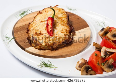baked chicken breast on wooden plate