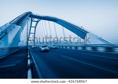 motion blurred traffic on the yangtse river bridge,chongqing china. Royalty-Free Stock Photo #426768067