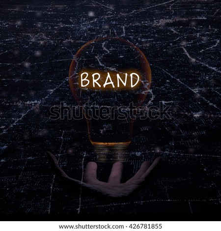 Brand idea concept with with light bulb and hand