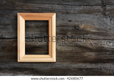 blank frame on old wooden background