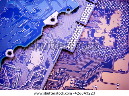 Circuit board. Blue industrial background.