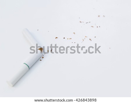 Quit smoking concept, cigarette butt with ash isolated on white background  / soft focus