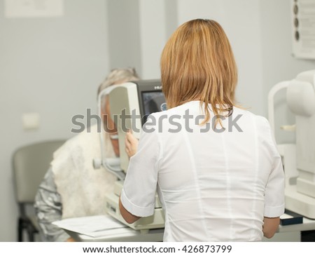 the elderly woman on reception at the ophthalmologist