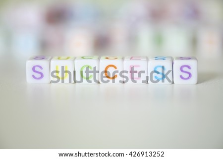 close up image, SUCCESS word written on plastic block, business concept ,