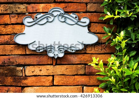 Blank banner with wooden thai frame on brick wall background