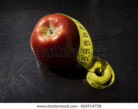 red apple and yellow centimeter diet concept 