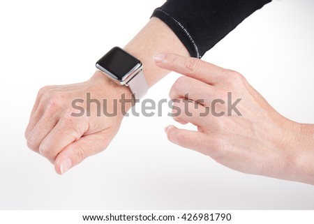 Woman's hand using a watch isolated on white background