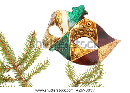 Carnival mask and christmas tree. Isolated on white