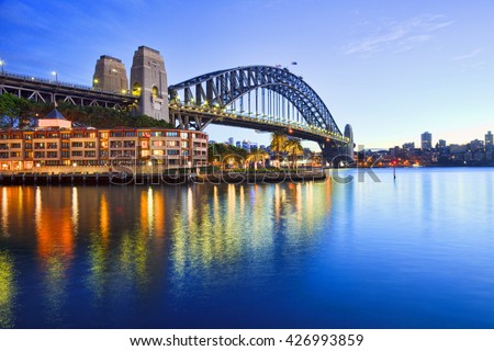 Sydney Harbour Bridge, illuminated at twilight.