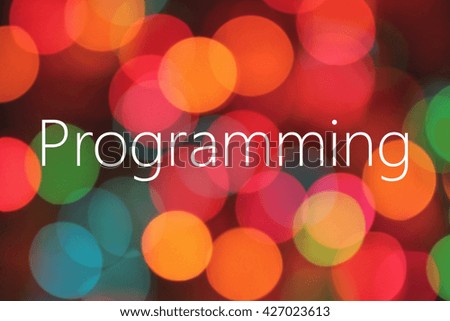Programming text on colorful bokeh background