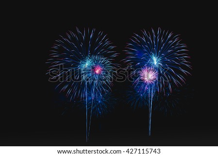 Beautiful fireworks of colors bursting against a black background display for celebration