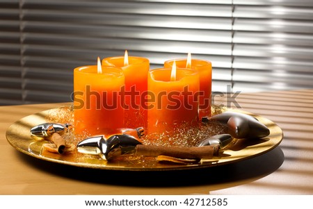 Advent wreath with four lit candle and stars