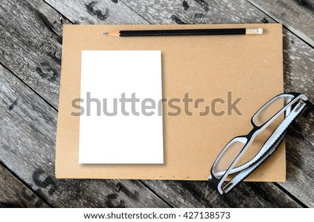 Mock up blank notebook and  pencil on wooden background, conservation concept