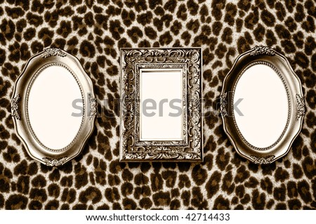 Golden frames on leopard skin background
