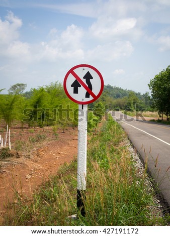 Do not overtake traffic sign board on national highway, selective focus
