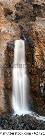 Rapid waterfall in the mountain