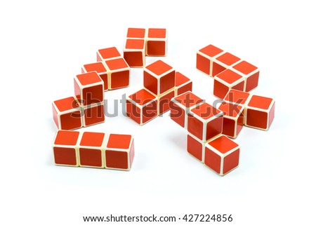Elements of old soviet red plastic cube puzzle on white background