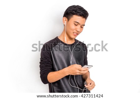a thai boy listening to music