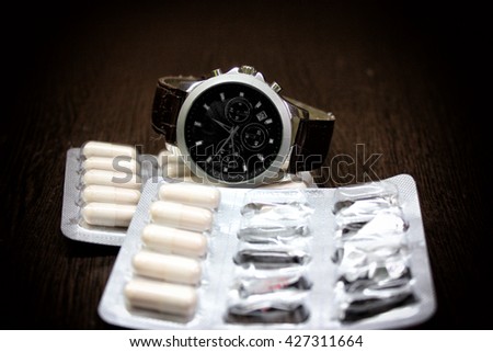 tablet pills and watch
