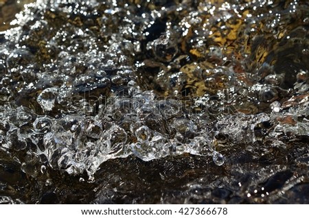 beautiful clear cold and clean river water in summer sunshine closeup 