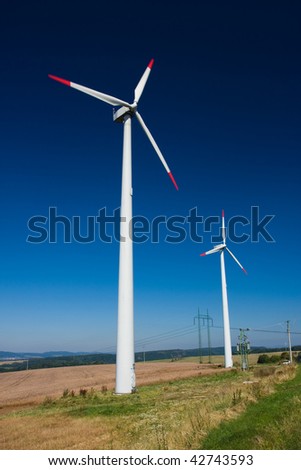 Photo of Wind power installation in sunny day
