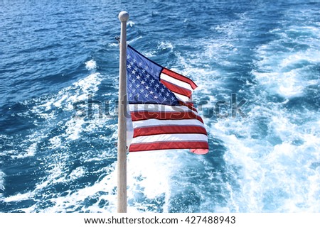 The United States of America's Flag partnered with a cool blue ocean backdrop.