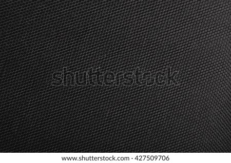 Close up of black textured synthetical backgroun