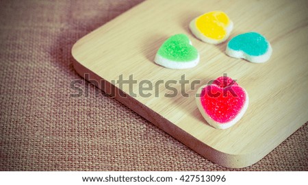 Sweet hearts jelly on wood,copy space for text