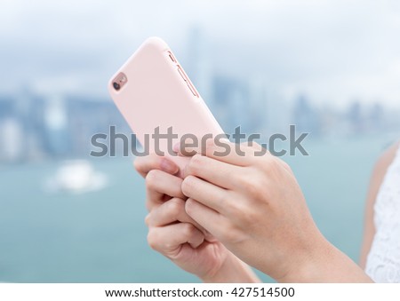 Woman send sms on cellphone
