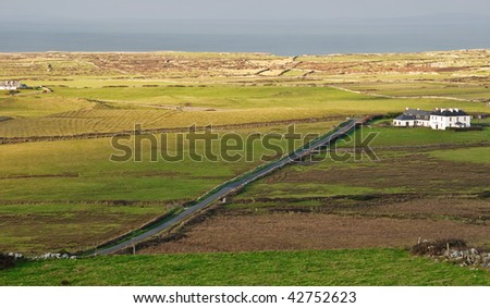 photo of a scenic landscape in rural ireland with house