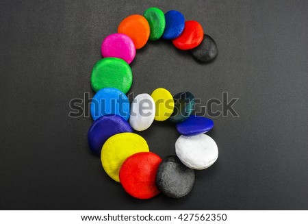 The number six, laid out the colored stones