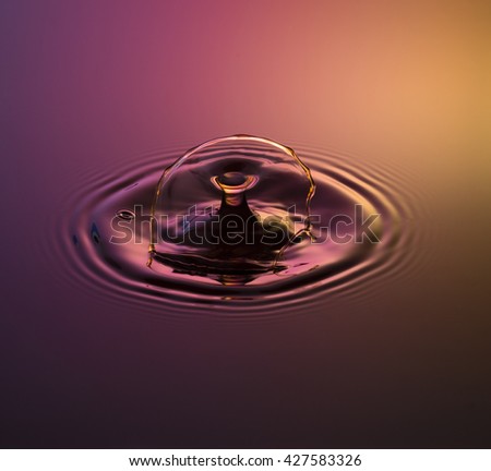 Golden Goblet - Water drop photography, one or two drops of water dropped from height into water and captured as they hit the water or collide with each other.
